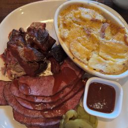 Pork burnt ends, cheesy potatoes, and smoked sausage. Pork burnt ends, cheesy potatoes, and smoked sausage.