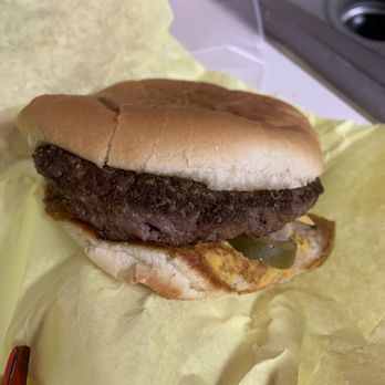 Pride Burger - a hand holding a hamburger - Fast Food Near Me - Mc Kinney, Texas