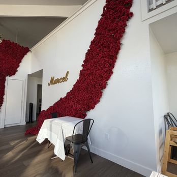 Marcel - Interior Restaurant Sign and Wall of Roses - Coffee & Tea Near Me - San Francisco, California Marcel - Interior Restaurant Sign and Wall of Roses - Coffee & Tea Near Me - San Francisco, California