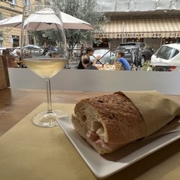 A panino and a glass of wine A panino and a glass of wine