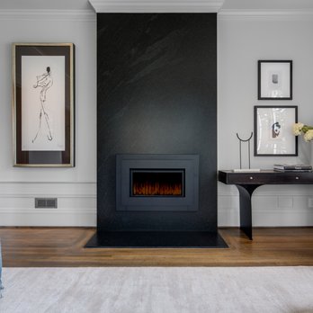 Vonnegut Thoreau Construction - a living room with a fireplace - General Contractors Near Me Vonnegut Thoreau Construction - a living room with a fireplace - General Contractors Near Me