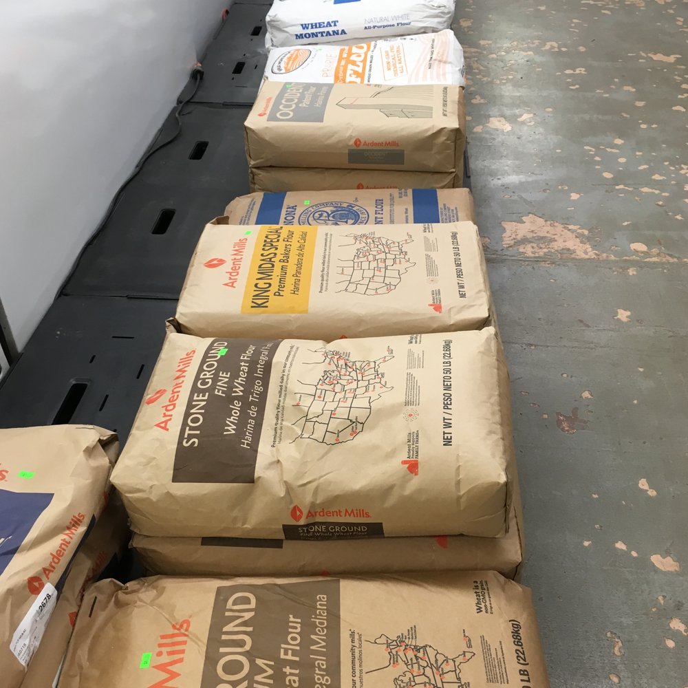 Farmers Pantry - a long line of bags of food - Grocery Near Me - Marshfield, Wisconsin