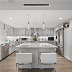 The Hallmark - An interior photo of the luxury, modern kitchen available at senior apartments at The Hallmark.