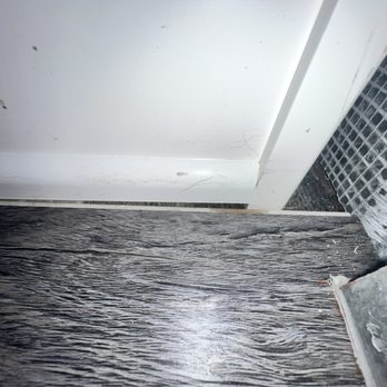 Moreno Framing And Carpentry - Missing baseboard between the inside of the island waterfall slab. - General Contractors Near Me