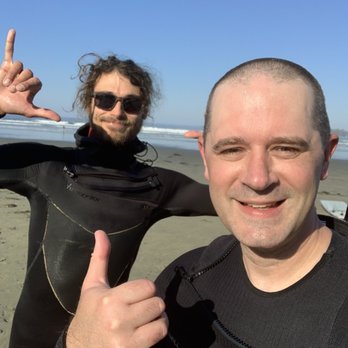 Tofino Surf School - Keane (best instructor ever) and me in the foreground. - Surf Schools Near Me - Tofino, British Columbia Tofino Surf School - Keane (best instructor ever) and me in the foreground. - Surf Schools Near Me - Tofino, British Columbia