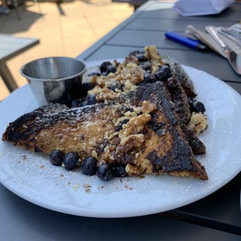 Belle - BRIOCHE FRENCH TOAST candied walnuts, maple syrup, powdered sugar with a daily topping . This one with walnuts and blueberries! Delish! - Breakfast & Brunch Near Me - Charlottesville, Virginia