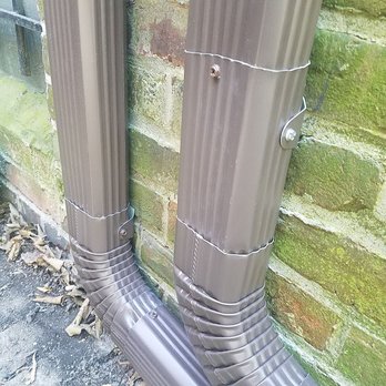 Manny Gutter Services - New downspouts and securely attached elbows to other pieces and clamps in the back. - Roofing Near Me