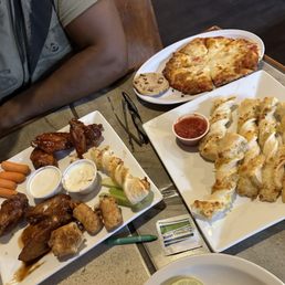 Bbq and spicy pb&j wings, mac n jack bites, crispy southwest chicken rolls, garlic parmesan twists, kids pizza meal