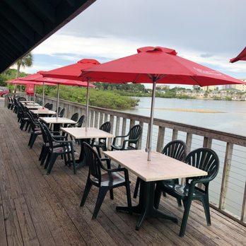 Our Deck Down Under - A view of the tables on the outside deck - Seafood Near Me - Port Orange, Florida Our Deck Down Under - A view of the tables on the outside deck - Seafood Near Me - Port Orange, Florida