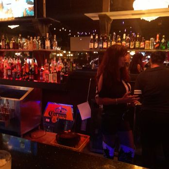 Gigi's Bar & Cafe - Gigi behind the bar. - Music Venues Near Me - Pompano Beach, Florida