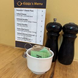 A kids menu on the table. A kids menu on the table.