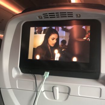 Delta Air Lines - Charging my phone while enjoying the movie - Airlines Near Me - Seattle, Washington