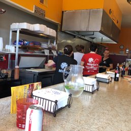 Running the kitchen while you wait.  Cool to watch them work
