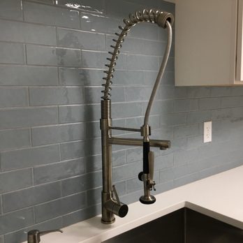 Exemplary Finishes - a kitchen sink and faucet - General Contractors Near Me