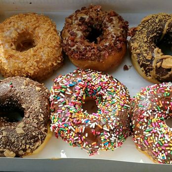 Donut King - Coconut crunch, maple bacon, Heath bar, Nutter butter, chocolate sprinkle Donuts. - Donuts Near Me - Winter Park, Florida Donut King - Coconut crunch, maple bacon, Heath bar, Nutter butter, chocolate sprinkle Donuts. - Donuts Near Me - Winter Park, Florida