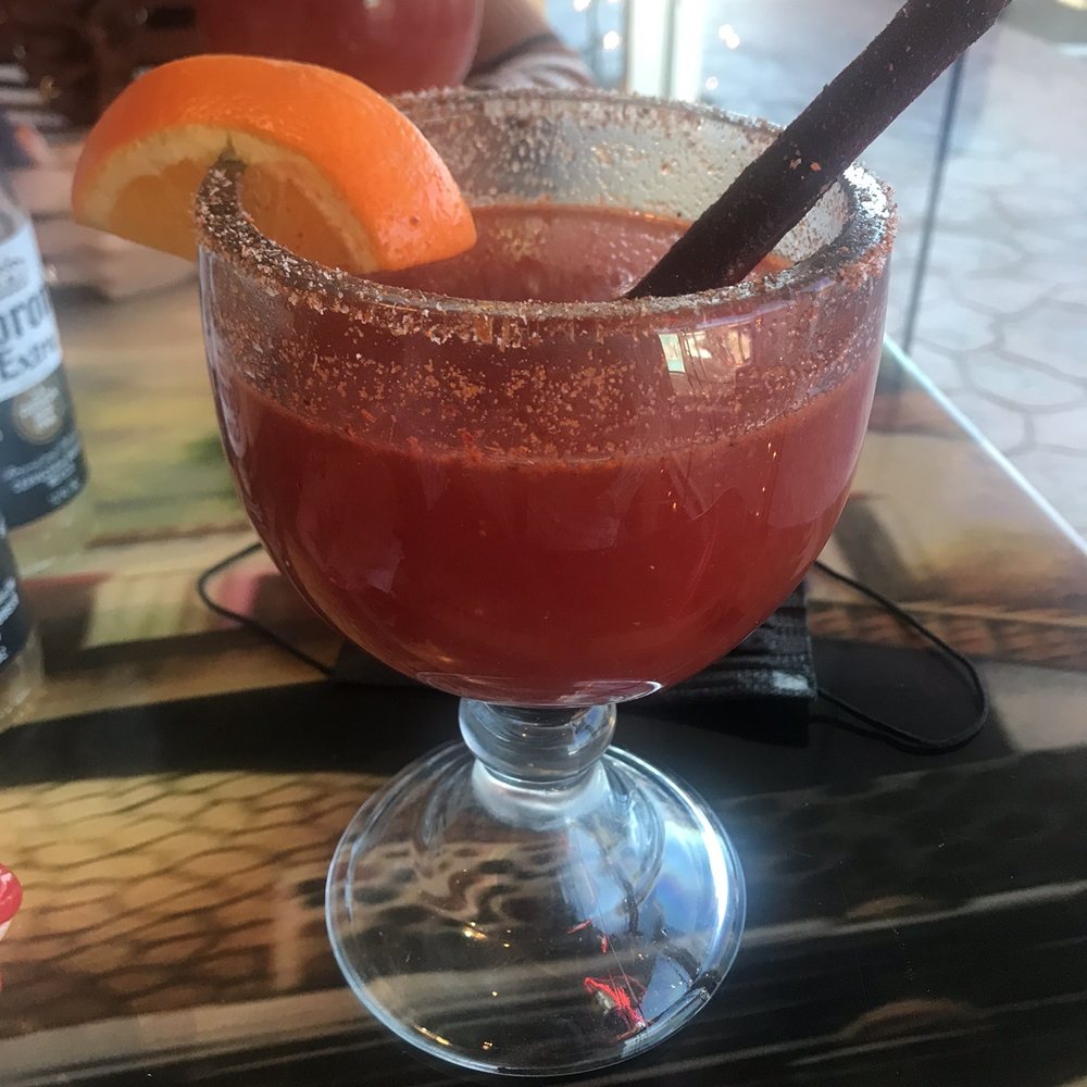 a margarita with a slice of orange