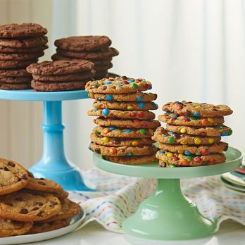 Great American Cookie - a stack of cookies on a cake stand - Bakeries Near Me - Beaumont, Texas