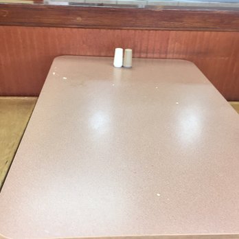 Bojangles - a table with two salt and pepper shakers on it - Fast Food Near Me - Mooresville, North Carolina