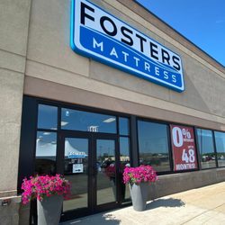 Fosters Mattress - The outside of Fosters Mattress store with petunias in bloom