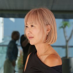Theodora Hair Studio Olympic - Peach blonde color and a precision bob haircut at Theodora Hair Studio in Los Angeles.