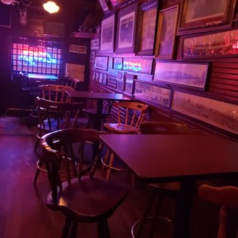 Vincent's - a dimly lit bar with wooden tables and stools - Sandwiches Near Me - Worcester, Massachusetts