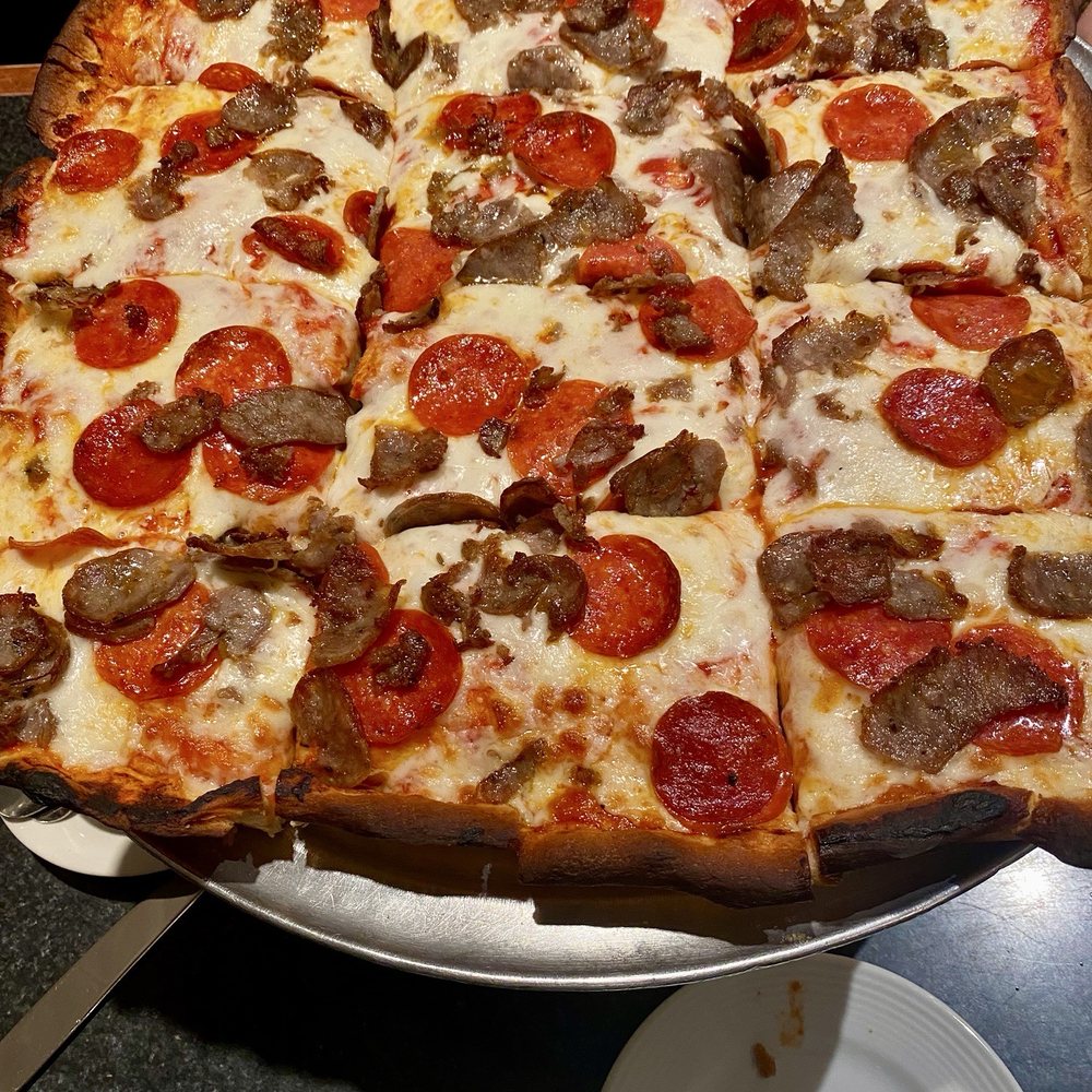 Sausage and pepperoni Sicilian pizza in Sausage and pepperoni Sicilian pizza in