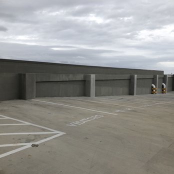 Mag & May - This is visitor parking on the 6th floor... no signs about towing policies here either. - Apartments Near Me - Fort Worth, Texas