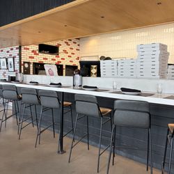 The empty counter regardless they're making me wait and wait for extraordinarily expensive pizza