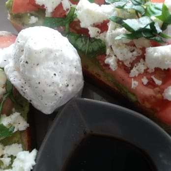Hungry Grasshopper Cafe - Avo , tomato & fetta on linseed toast, poached egg & balsamic reduction - Cafes Near Me - Haberfield, NSW