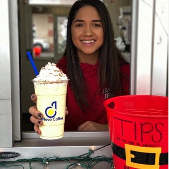 DeNovo Coffee - a woman holding a cup of coffee - Coffee & Tea Near Me - Spring, Texas DeNovo Coffee - a woman holding a cup of coffee - Coffee & Tea Near Me - Spring, Texas