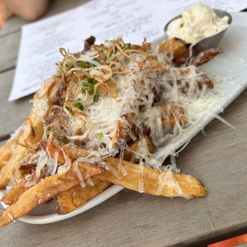 Poquito - a plate of french fries on a table - Tapas/Small Plates Near Me - Holland, Michigan Poquito - a plate of french fries on a table - Tapas/Small Plates Near Me - Holland, Michigan