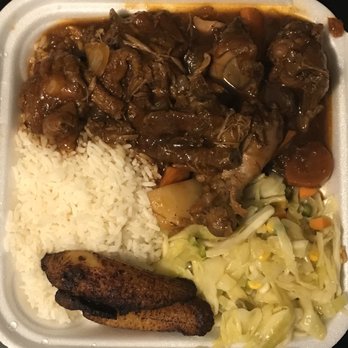 Golden Krust Caribbean Restaurant - Brown Stew Chicken with white rice and cabbage - Caribbean Near Me - Raleigh, North Carolina Golden Krust Caribbean Restaurant - Brown Stew Chicken with white rice and cabbage - Caribbean Near Me - Raleigh, North Carolina