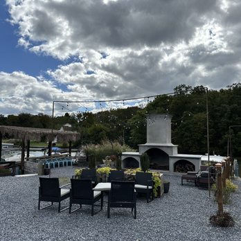 Charlys Waterfront - a patio with a fire place - Burgers Near Me - Essex, Maryland