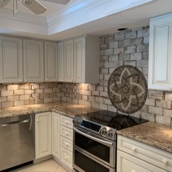 Delta Tile - Backsplash-Porcelain tile with medallion.