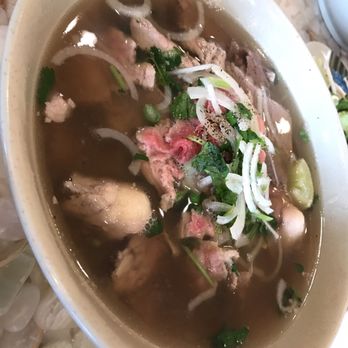 Pho Binh 59 South - Pho with crispy pork and the raw beef . Yuzzum - Vietnamese Near Me - Houston, Texas