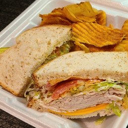 Turkey w/ lettuce, tomato, bacon, cheese, & mayo on whole wheat.