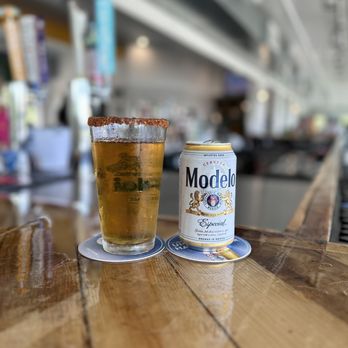 Flamingo Landing - a glass of beer and a can of modelo - Seafood Near Me - Gulfport, Mississippi Flamingo Landing - a glass of beer and a can of modelo - Seafood Near Me - Gulfport, Mississippi