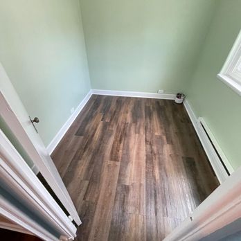E&J Quality Solution - a hardwood floor in a room - Flooring Near Me E&J Quality Solution - a hardwood floor in a room - Flooring Near Me