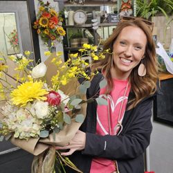 Siloam Flowers & Gifts - Katelyn showing a wrapped bouquet for a Valentine's day gift. Both are so beautiful!