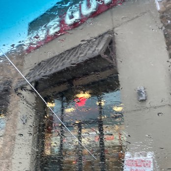 Five Guys - the reflection of a storefront in the rain - Burgers Near Me - Spanish Fork, Utah