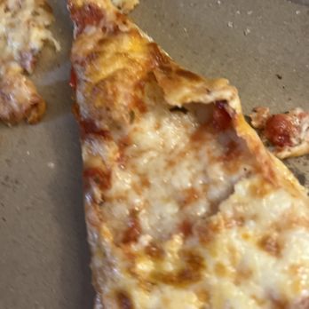 Madina Halal Pizza - a half eaten slice of pizza - Pizza Near Me - Toronto, Ontario Madina Halal Pizza - a half eaten slice of pizza - Pizza Near Me - Toronto, Ontario