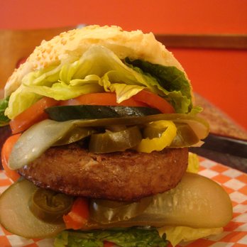 Mustache Burger - a hamburger with pickles and tomatoes - Food Trucks Near Me Mustache Burger - a hamburger with pickles and tomatoes - Food Trucks Near Me