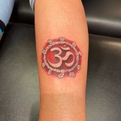 Southside Tattoo - This is the symbol of "Om" tattooed on the side of my left calf. I love it!