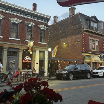 Mama’s on Main - The patio area with a lovely view. Perfect for people watching and enjoying the different vibes of the area. - Wine Bars Near Me - Covington, Kentucky Mama’s on Main - The patio area with a lovely view. Perfect for people watching and enjoying the different vibes of the area. - Wine Bars Near Me - Covington, Kentucky