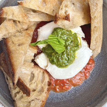 Alpana - Burrata with tomato chutney and pesto. - New American Near Me - Chicago, Illinois Alpana - Burrata with tomato chutney and pesto. - New American Near Me - Chicago, Illinois