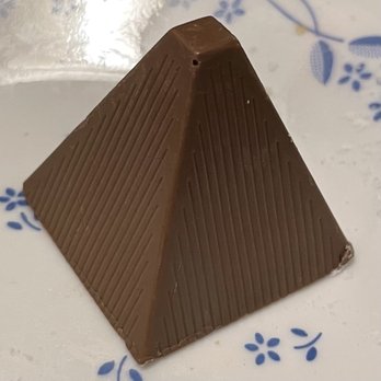 Athan's Bakery - Milk chocolate with alcoholic filling (bourbon?) and an almond - Bakeries Near Me - Brookline, Massachusetts