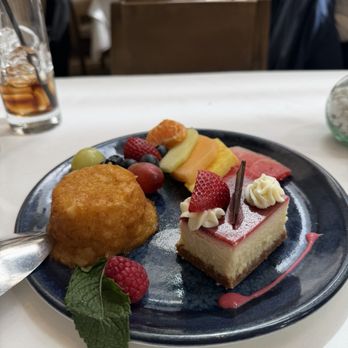 Avra Rockefeller Center - Strawberry cheesecake, fruit plate, and orange cake. - Greek Near Me - New York, New York Avra Rockefeller Center - Strawberry cheesecake, fruit plate, and orange cake. - Greek Near Me - New York, New York