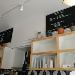 Behind the counter.