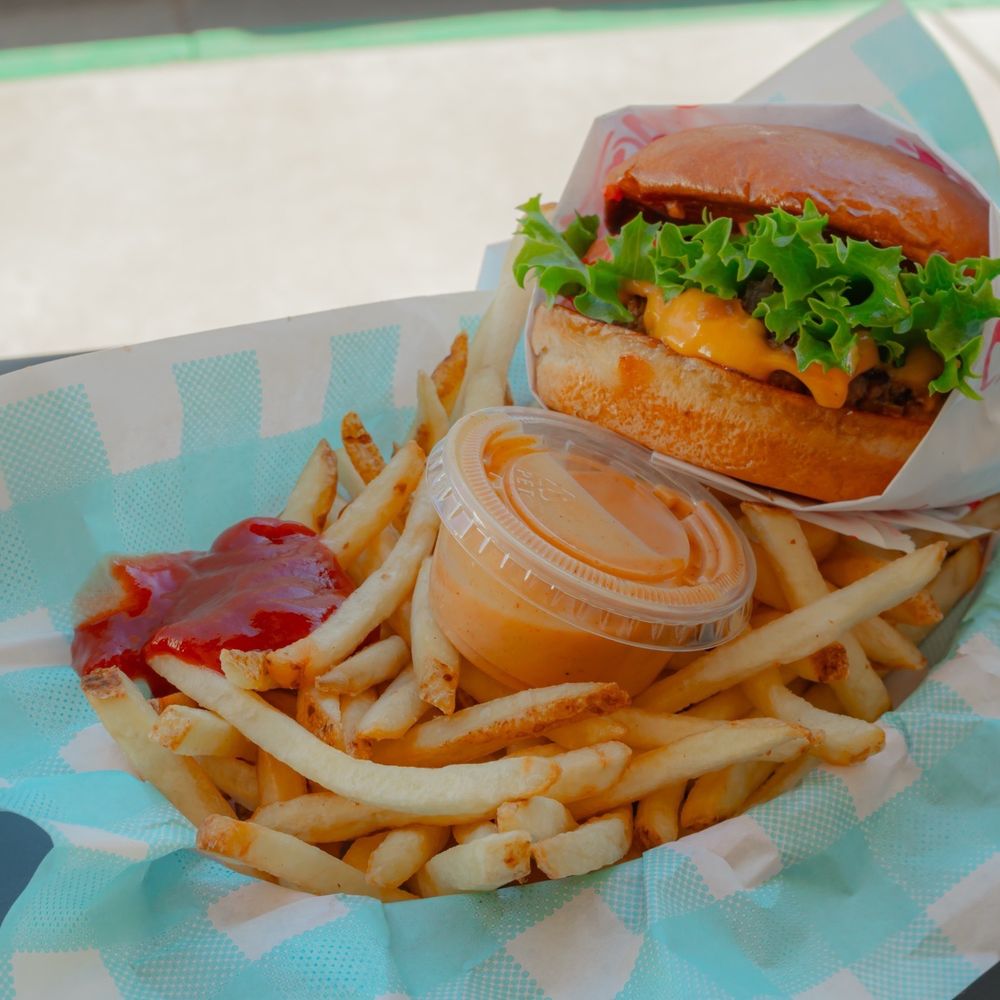 Double cheese burger and fries. Double cheese burger and fries.