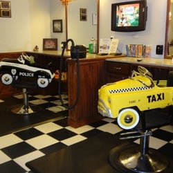 Classics Old Time Barber Shop - Great chairs for the kids to sit in and watch a Disney movie on the tv while getting a haircut. No crying here!